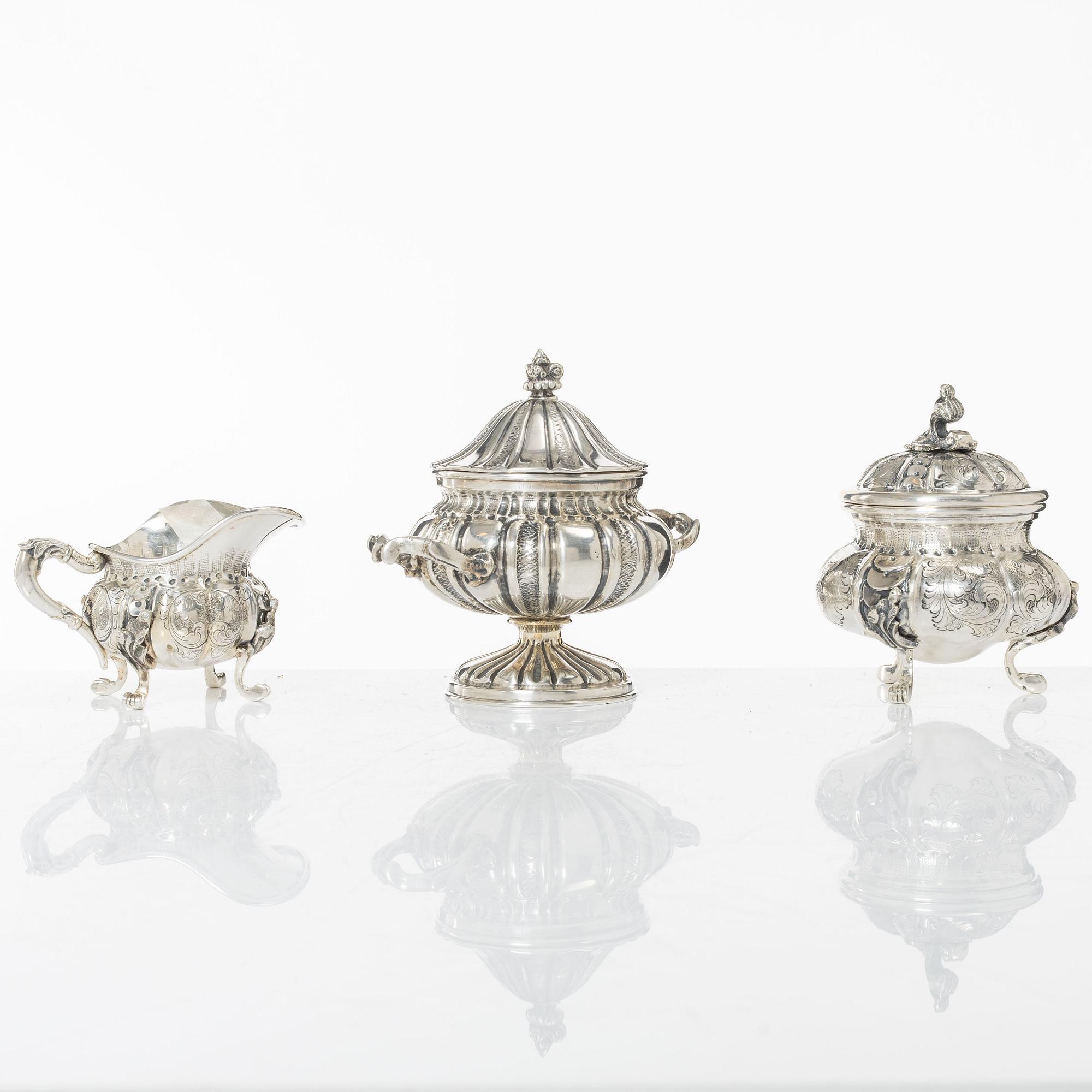 A silver sugar bowl and a set with creamer and sugar bowl, silver, 20th century.