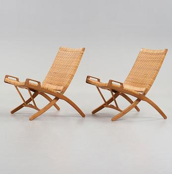 Hans J. Wegner, a pair of oak and rattan 'Folding chairs', model 512, Johannes Hansen, Denmark 1950's.