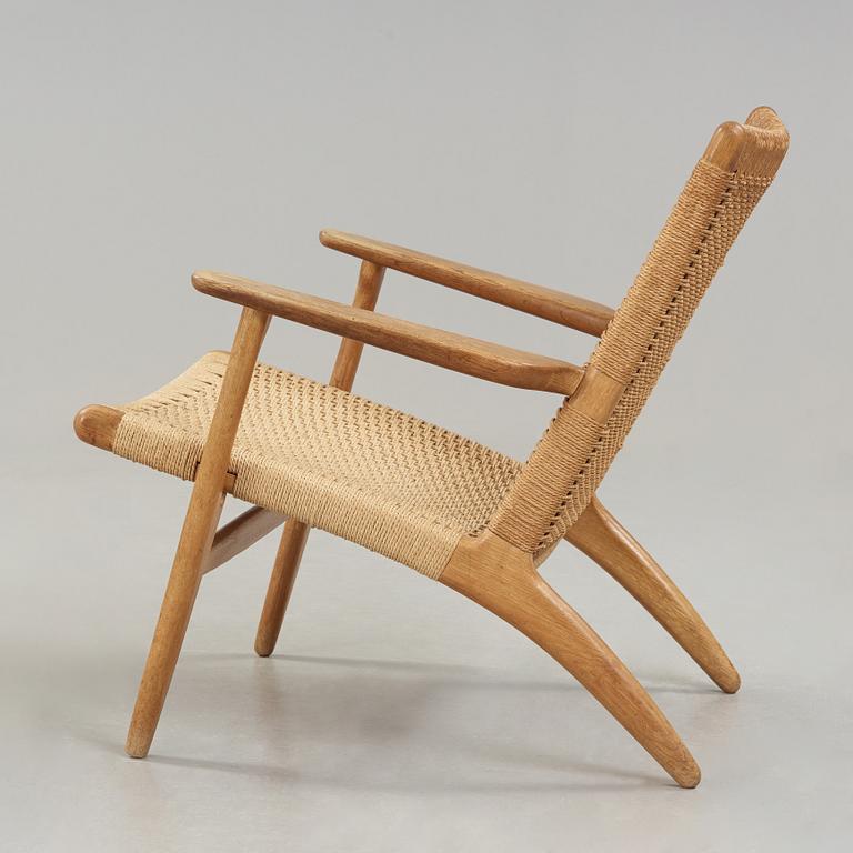 A Hans J Wegner 'CH-25' oak easy chair, Carl Hansen & Son, Denmark.