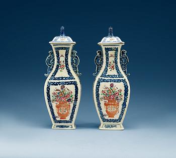 1453. A pair of famille rose vases with covers, Qing dynasty, Qianlong (1736-95).