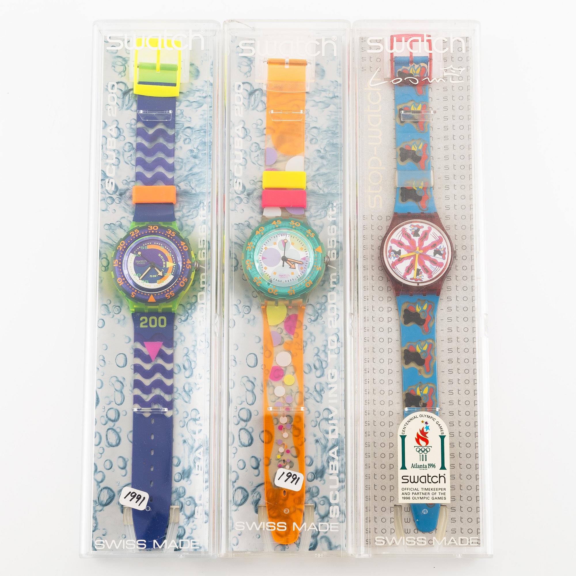 Parti med 21 Swatch-klockor, gummiband och klocklitteratur, "No Reserve".