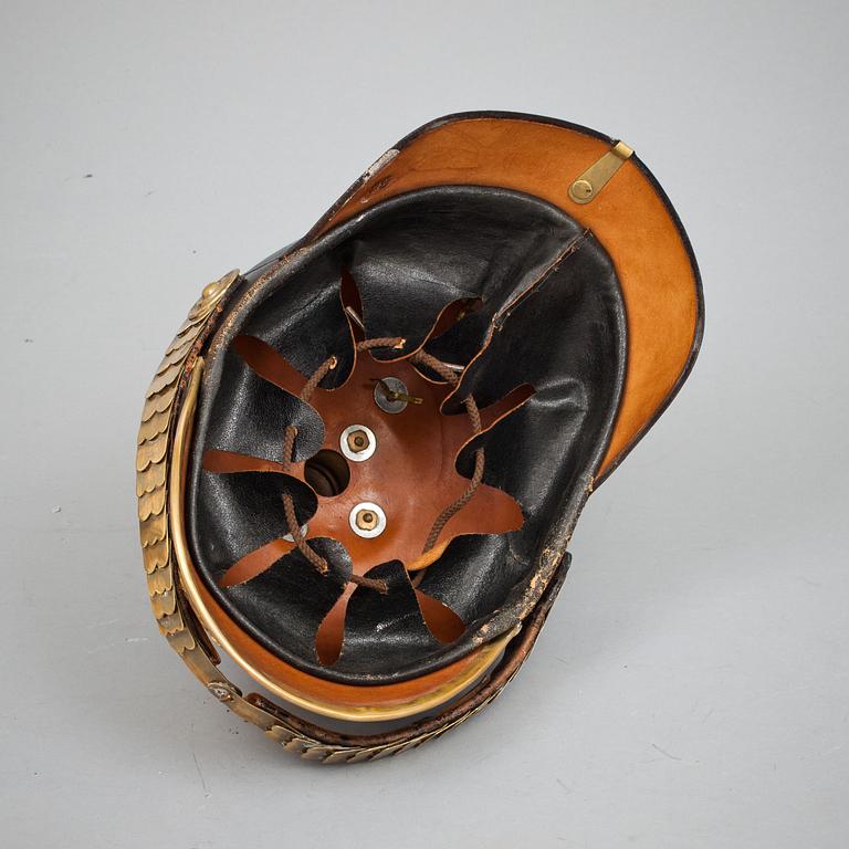 KASK, läder och mässing. Omkring 1900.