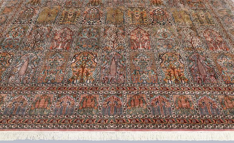 A Kashmir silk carpet, 418 x 297 cm.