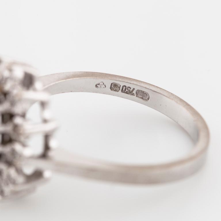 A sapphire and brilliant cut diamond ring with Swedish hallmark.