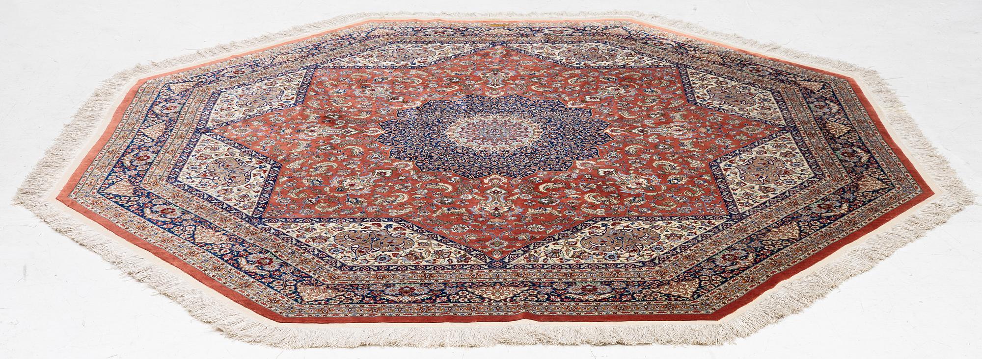 An Oktagonal  silk Qum rug, Central Persia, signed, c. 250 x 250 cm.