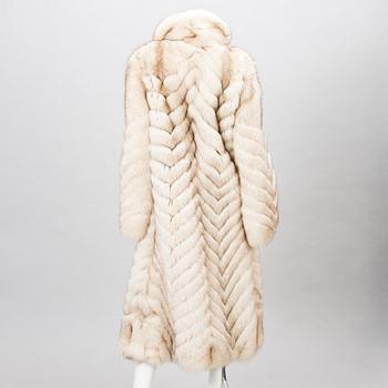 Off-white fox fur coat.