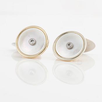 A pair of mother of pearl and brilliant-cut cuff links made by goldsmith Gustav Dahlgren & Co.