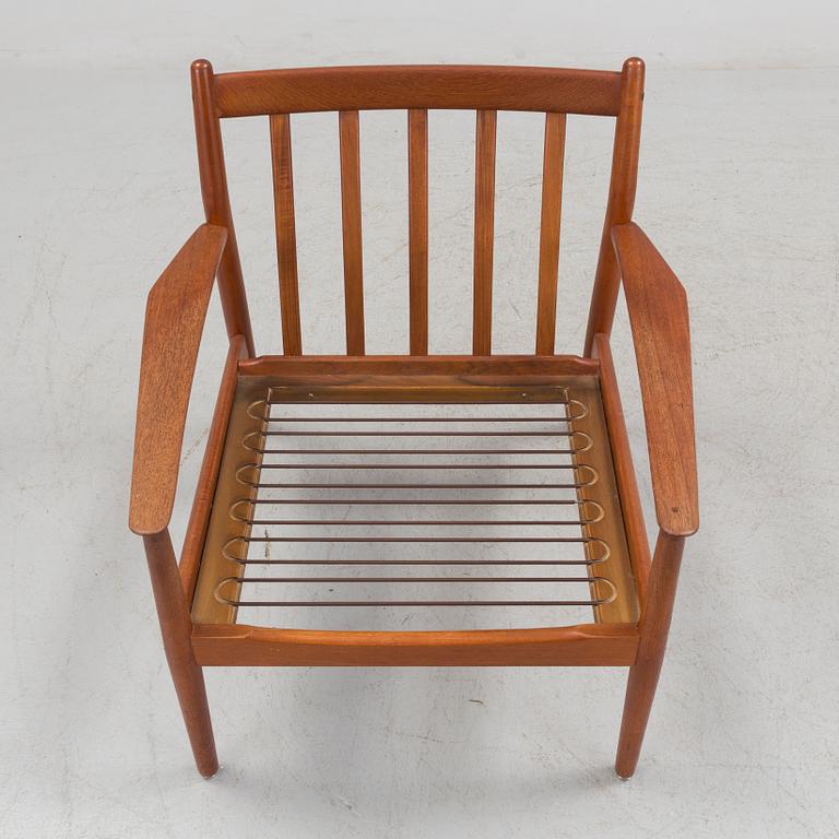 A 1960s teak Grete Jalk armchair from Glostrup, Denmark.