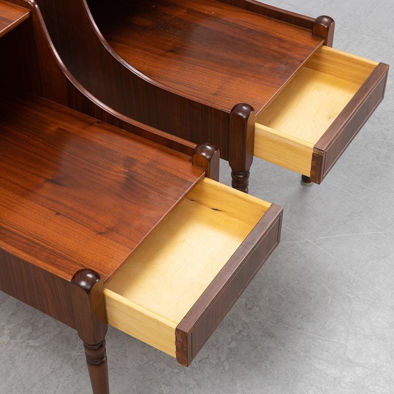 A pair of mahogany veneered bedside tables, later part of the 20th Century.
