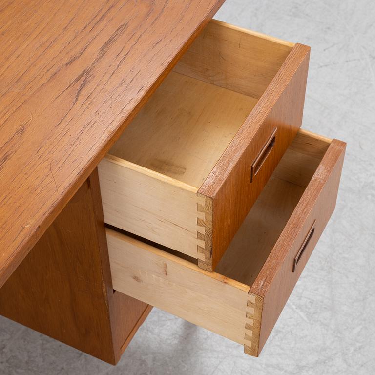 A teak veneered desk, mid 20th Century.