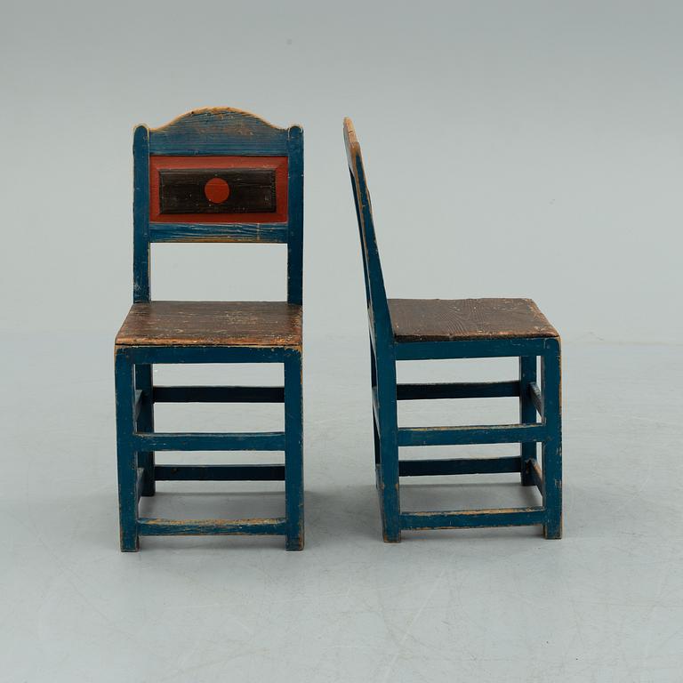 a pair of early 20th century chairs.