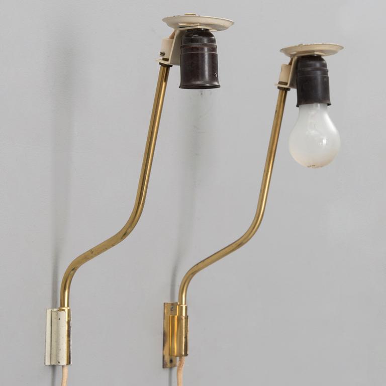 A pair of mid-20th century '3053' wall lights for Stockmann Orno, Finland.