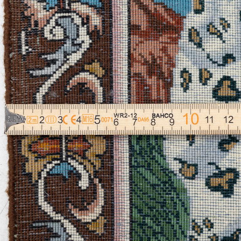 An oriental, figural rug, c. 64 x 50 cm.