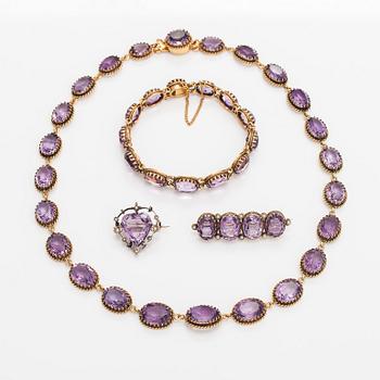 A necklace, bracelet and two brooches in gilded silver and with amethysts and pearls.