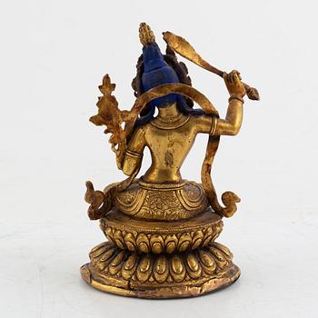 A gilt bronze figure of Manjushri, 20th century.