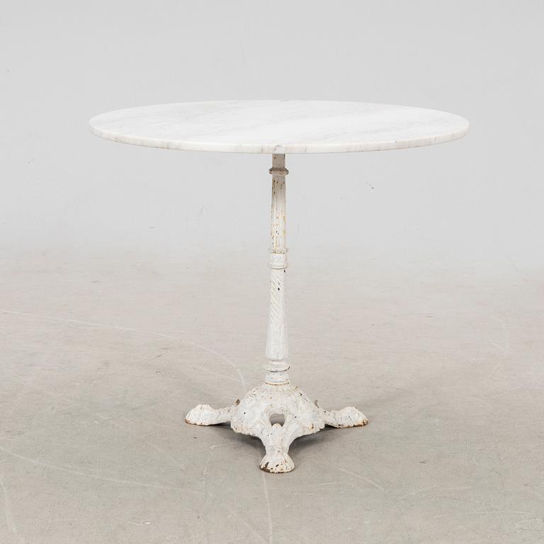 A marble and cast iron table 20th century.