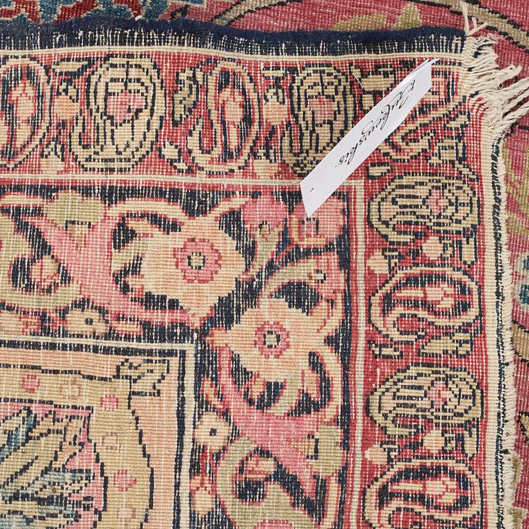 A CARPET, an antique Kerman Laver, ca 363 x 301 cm.