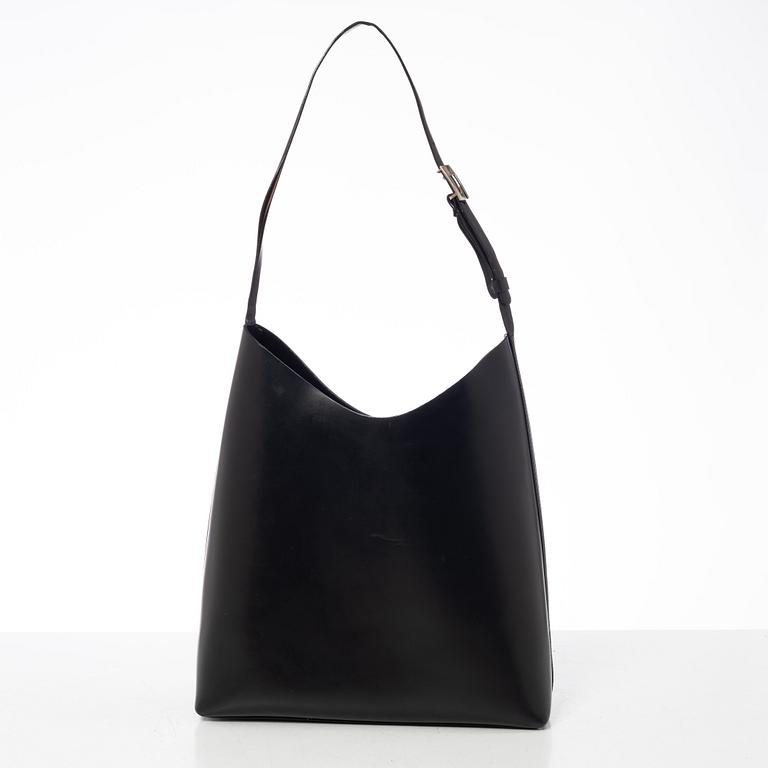 Gucci, A black leather bag.