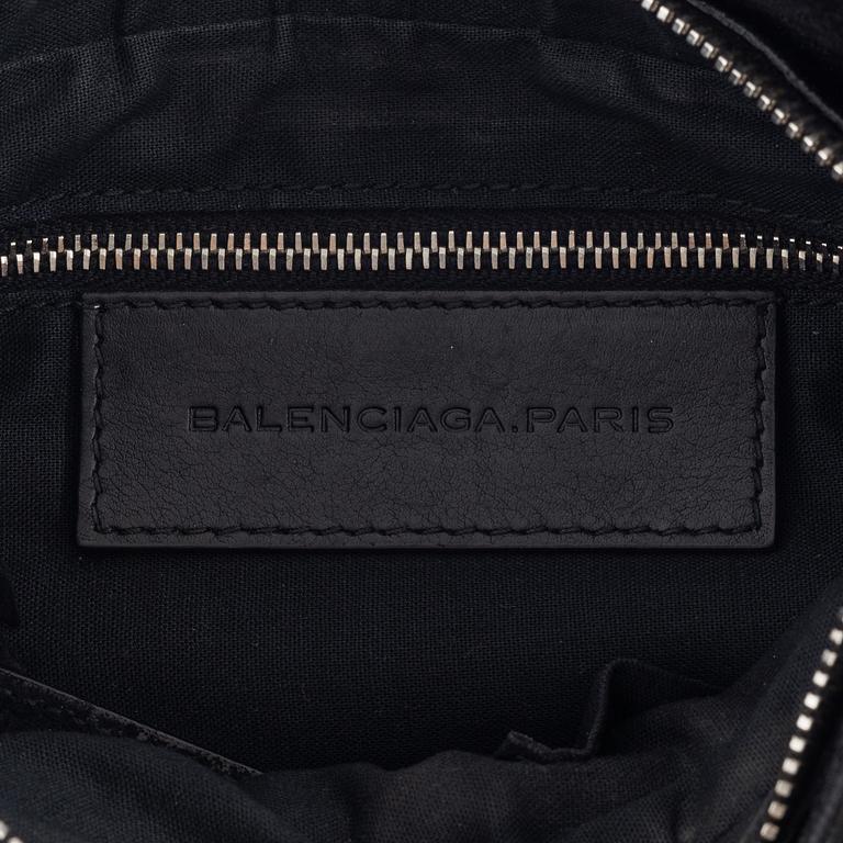 Balenciaga, a black suede 'City' crossbody bag.