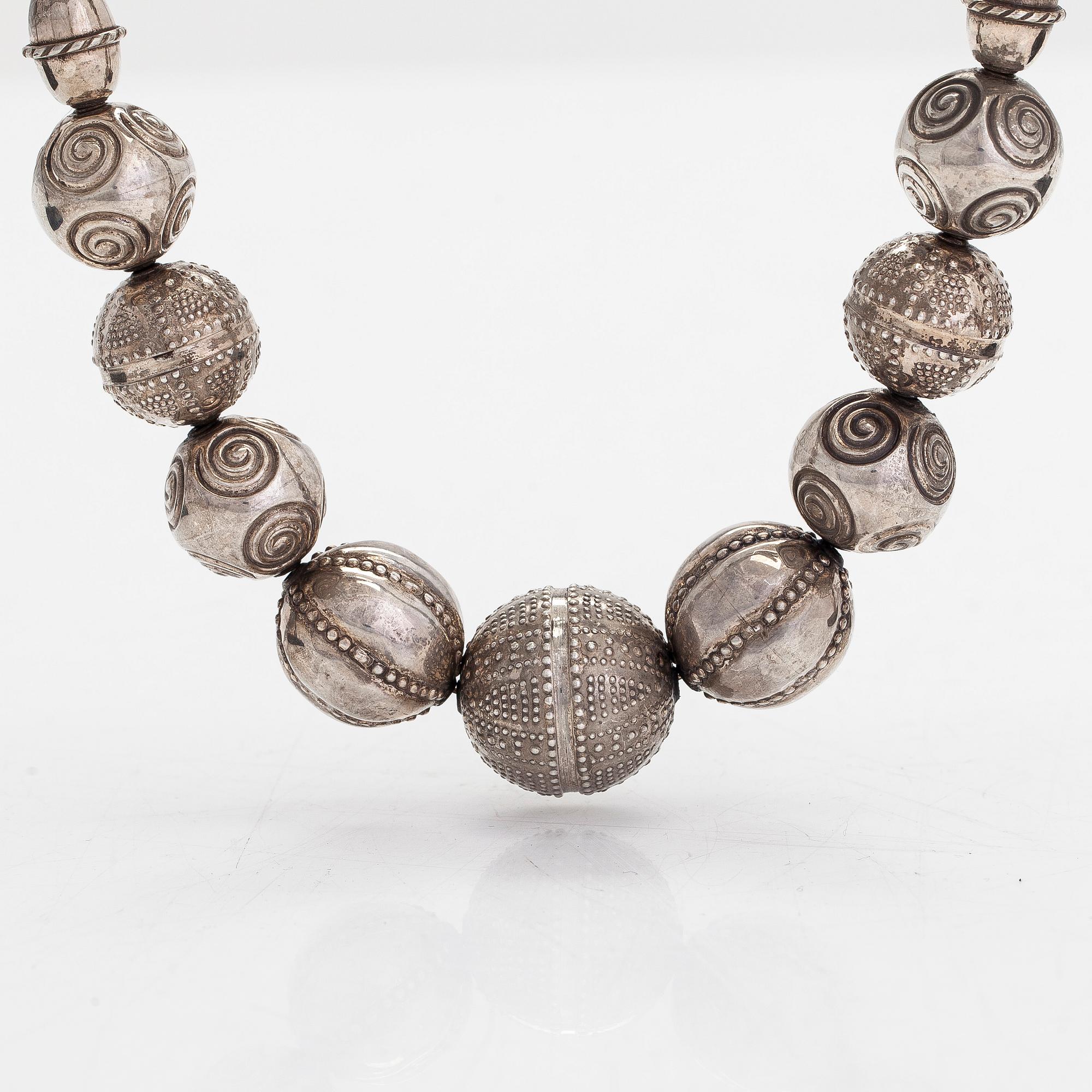 A set of silver "Halikko treasure" necklace, bracelet, ring and earrings. Kalevala Koru, Helsinki 1965-1972.