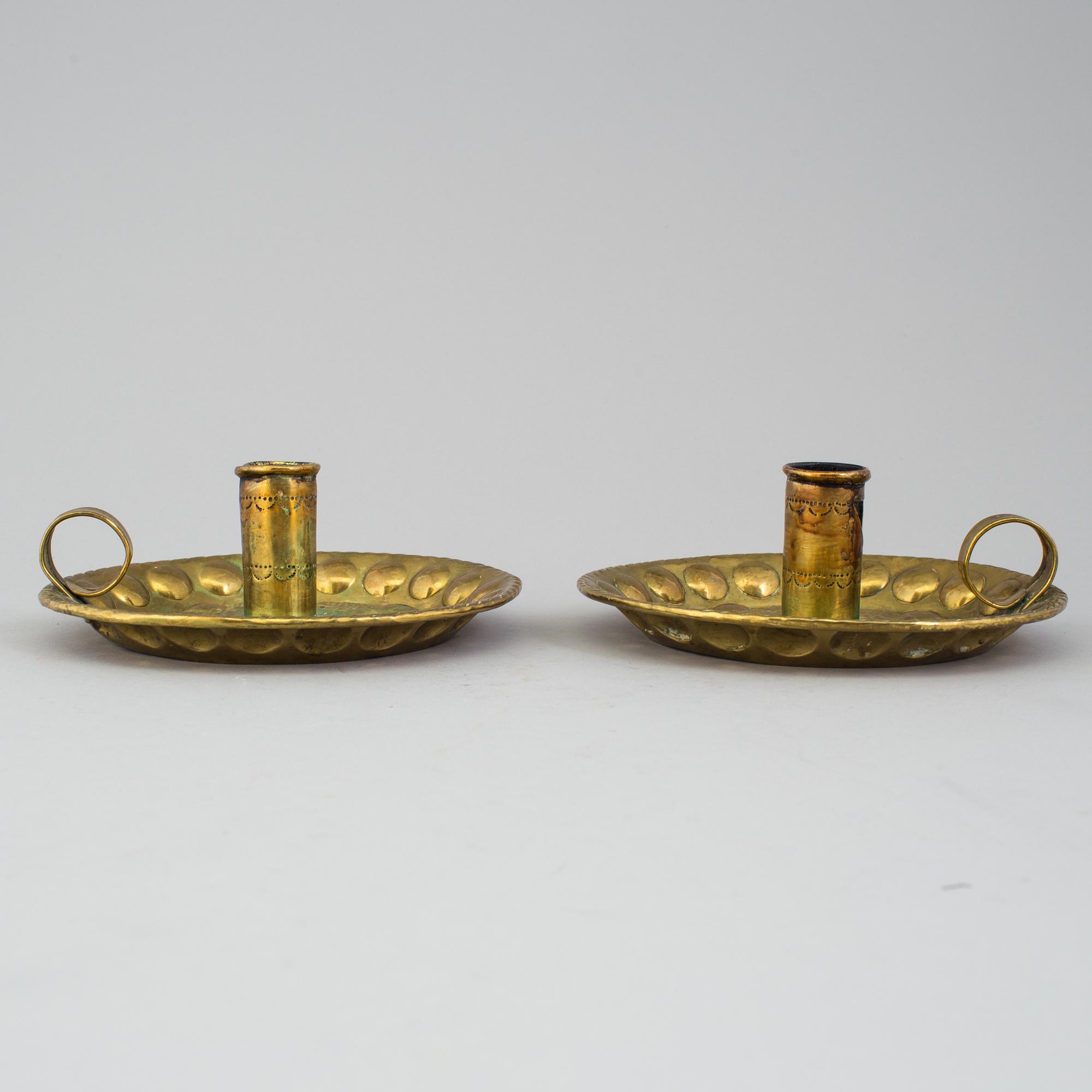 A pair of brass baroque style candlesticks.