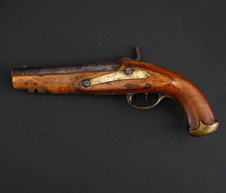 An early 19th century cap lock revolver.