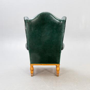 A  mid 1900s leather armchair.