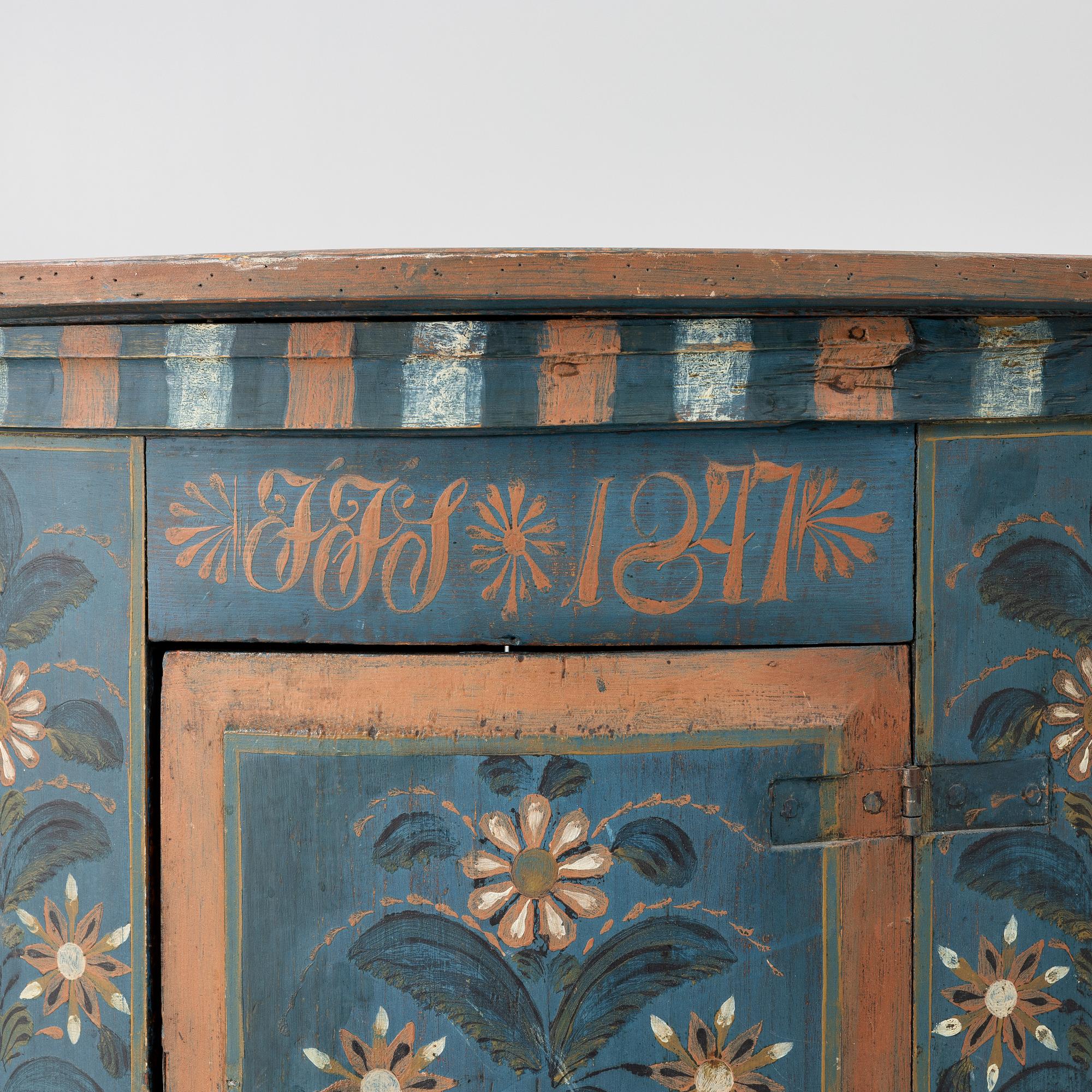 A folk art corner cabinet from Delsbo, Hälsingland dated 1847.