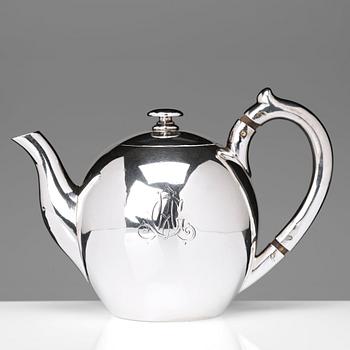 A German 20th century parcel-gilt silver tea-pot, marked Wilkens 875.