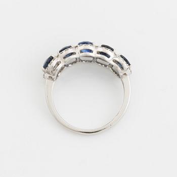 Oval sapphire and brilliant cut diamond ring.