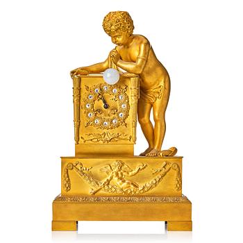 114. A Empire early 19th century gilt bronze " The Bubble Blower" mantel clock.