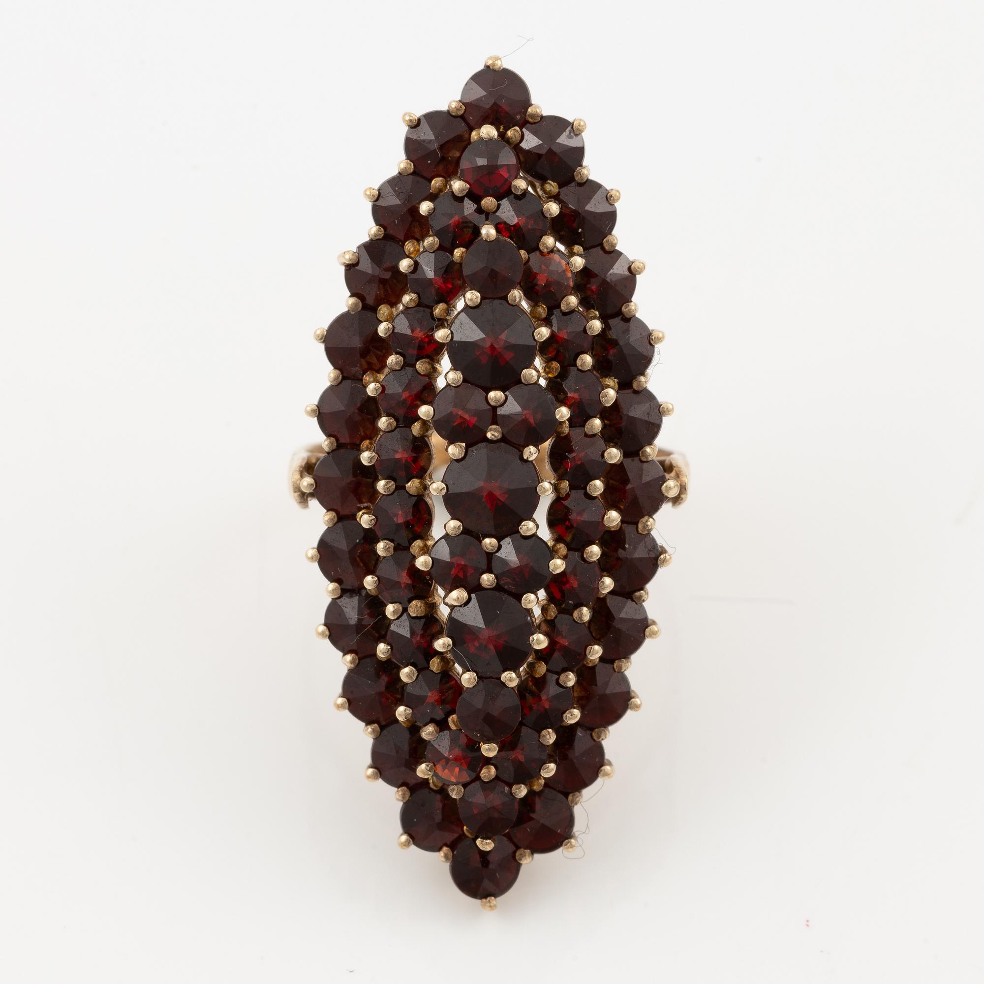 Garniture, two rings, brooch, two necklaces, and two pairs of earrings, armlet, garnets.