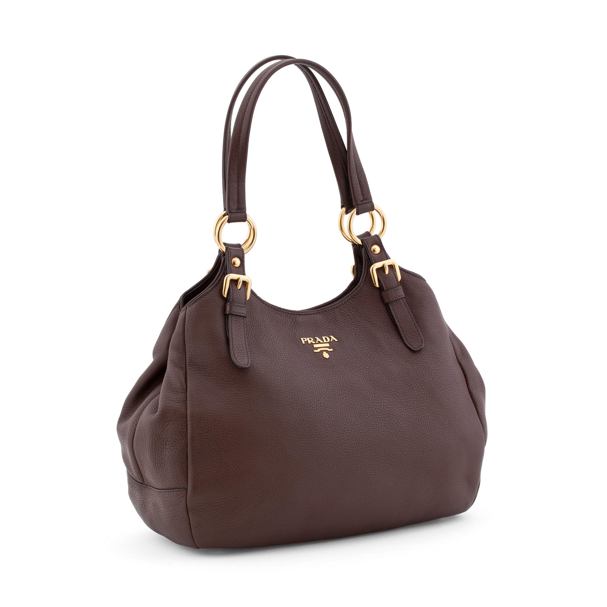 PRADA, a brown leather shoulder bag.