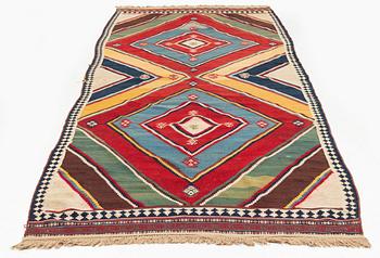An antique Qashqai kilim rug, c. 380 x 148 cm.