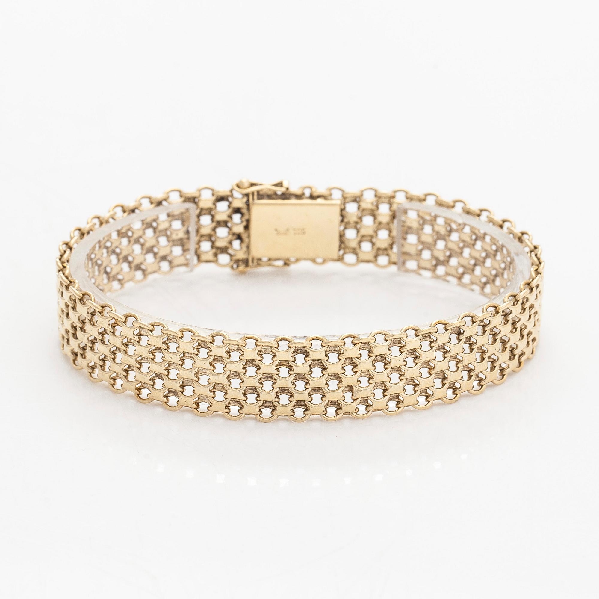 A 14K gold X-link bracelet, likely Norway.