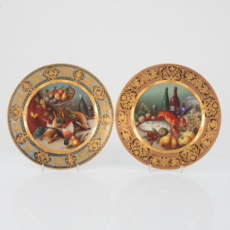 Two gilded and painted plates, around 1900.