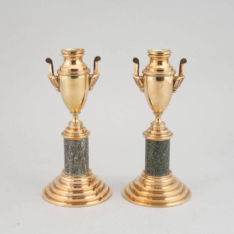 A pair of brass and marble candle holders/casslettes from Skultuna, 20th century.