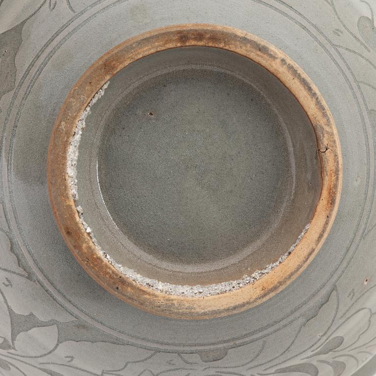 A slip decorated celadon bowl for the South East Asian market, 20th Century.