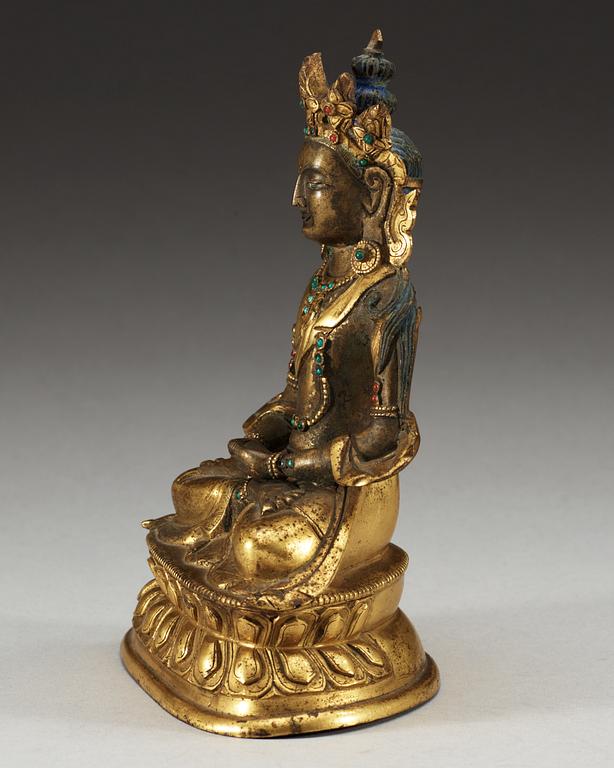 A partial-gilt bronze figure of Avalokiteshvara, Sino-Tibetan, 18th Century.