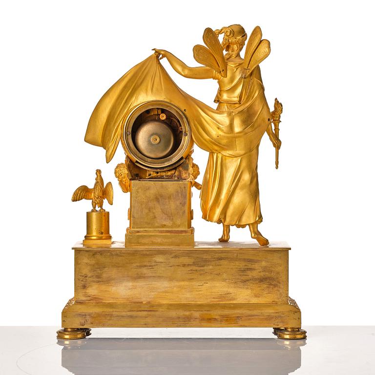 A French Empire mantel clock. Marked "LE NEPVEU A PARIS".