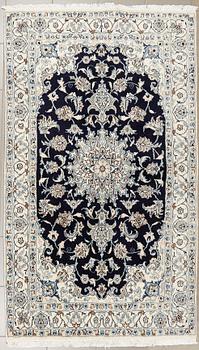 A Nain rug, 205 x 120 cm.