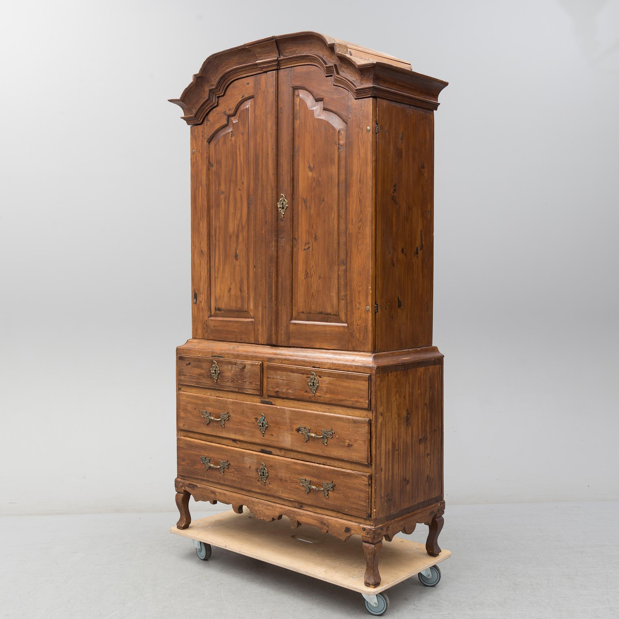 a 1700's Rococo pine cabinet.