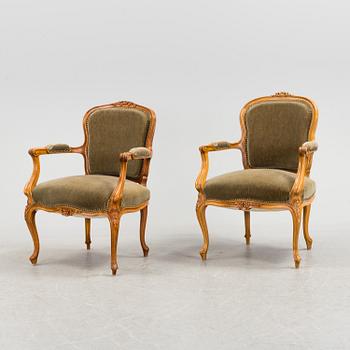 A pair of mid 20th century rococo style armchairs.