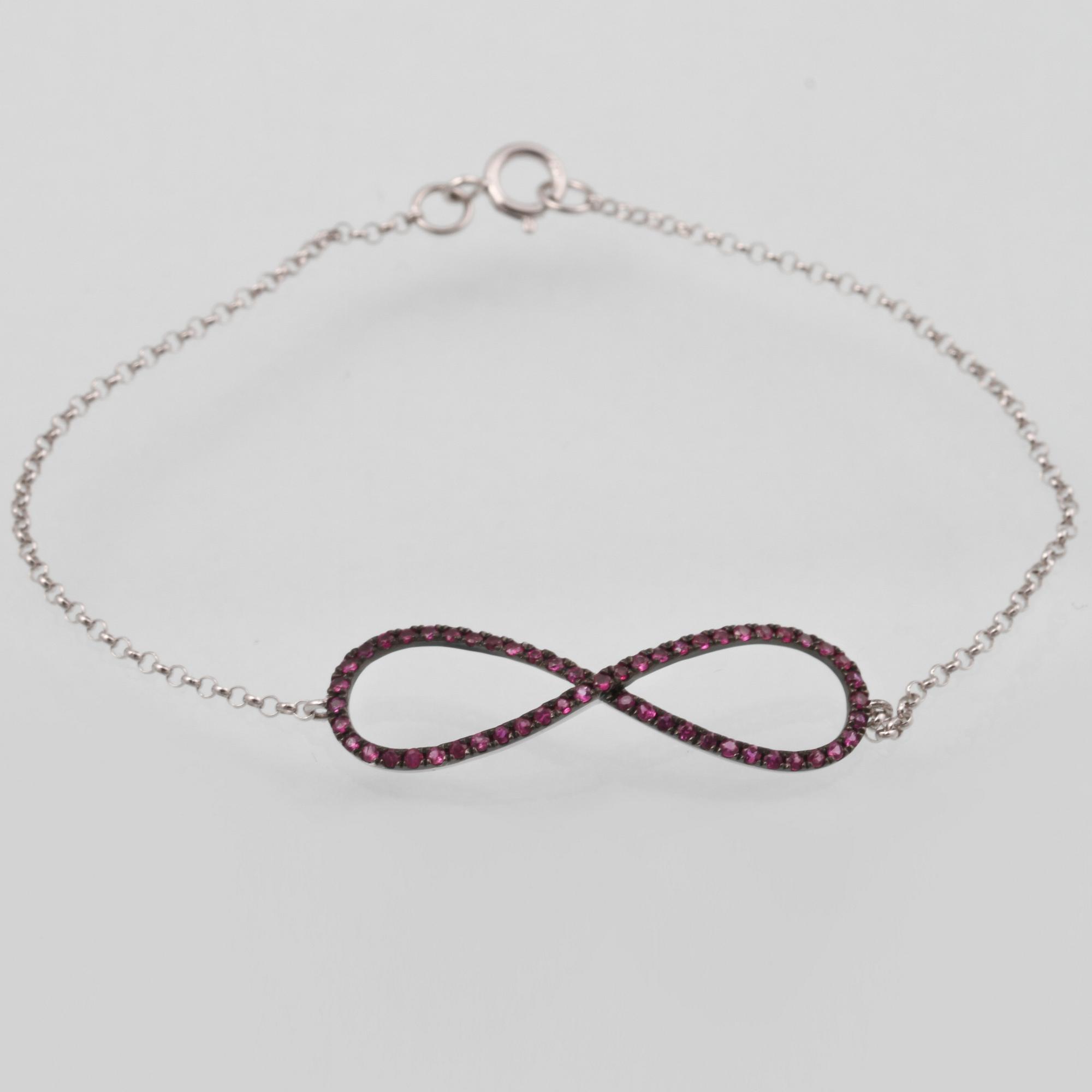 ARMBAND, 18K vitguld med fasettslipade rubiner ca 0.33 ct. Vikt 1,5 gram.