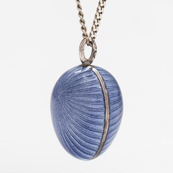 A Tillander, A silver necklace with an enameled egg.