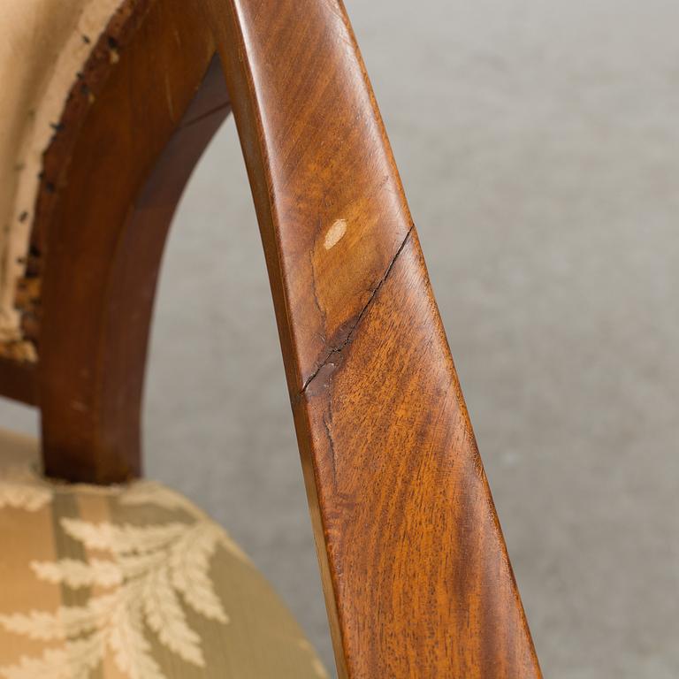 A pair of early 20th century Empire style armchairs.