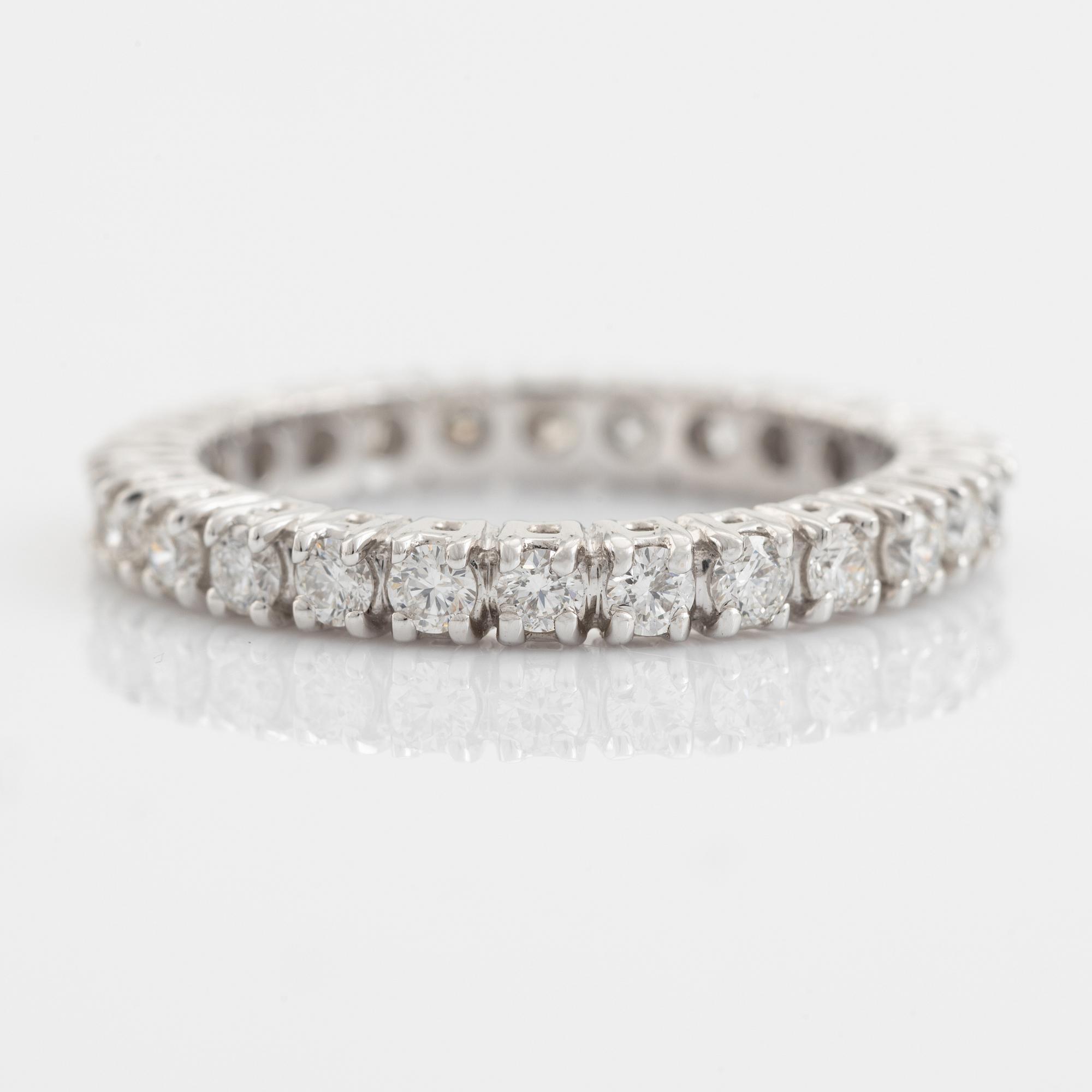 Brilliant cut diamond eternity ring.