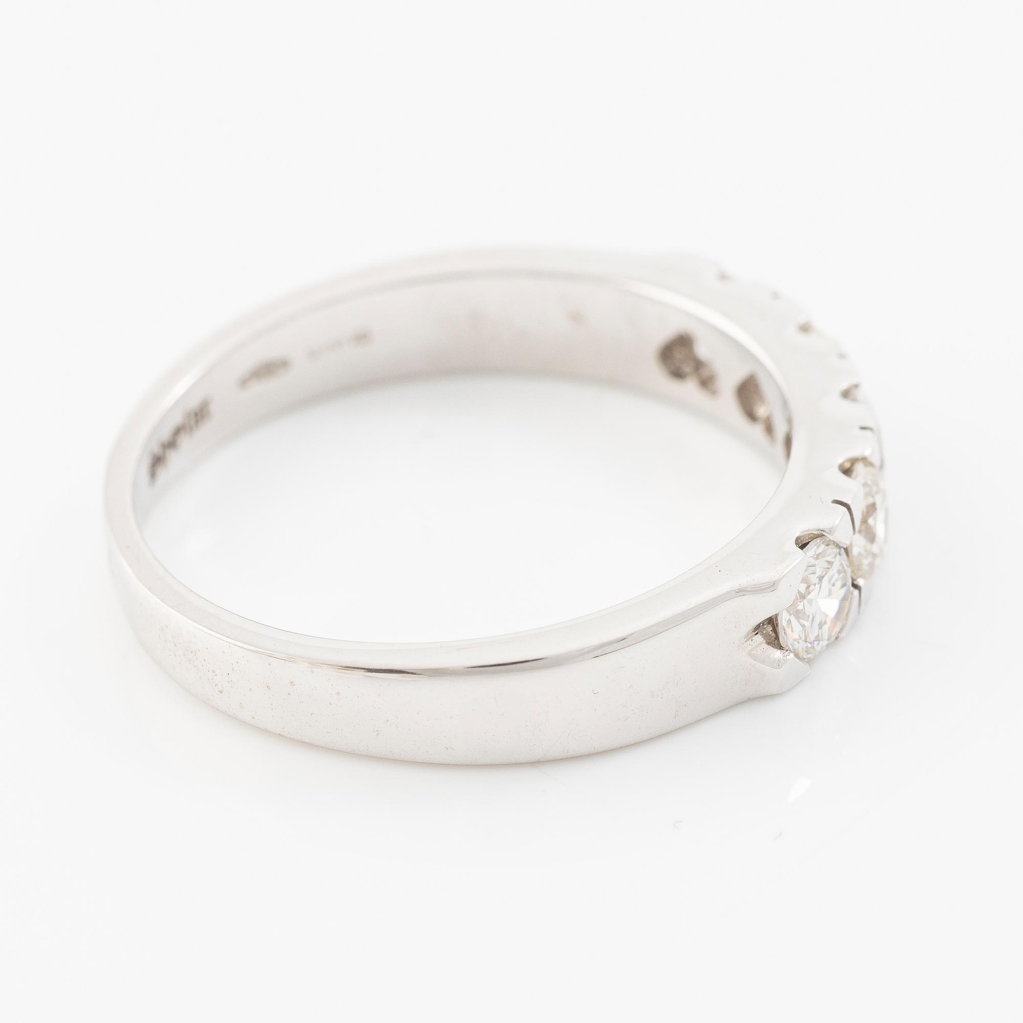 Ring 18K white gold half eternity band set with brilliant-cut diamonds.
