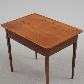 A 19th century mahogany table with drawer.