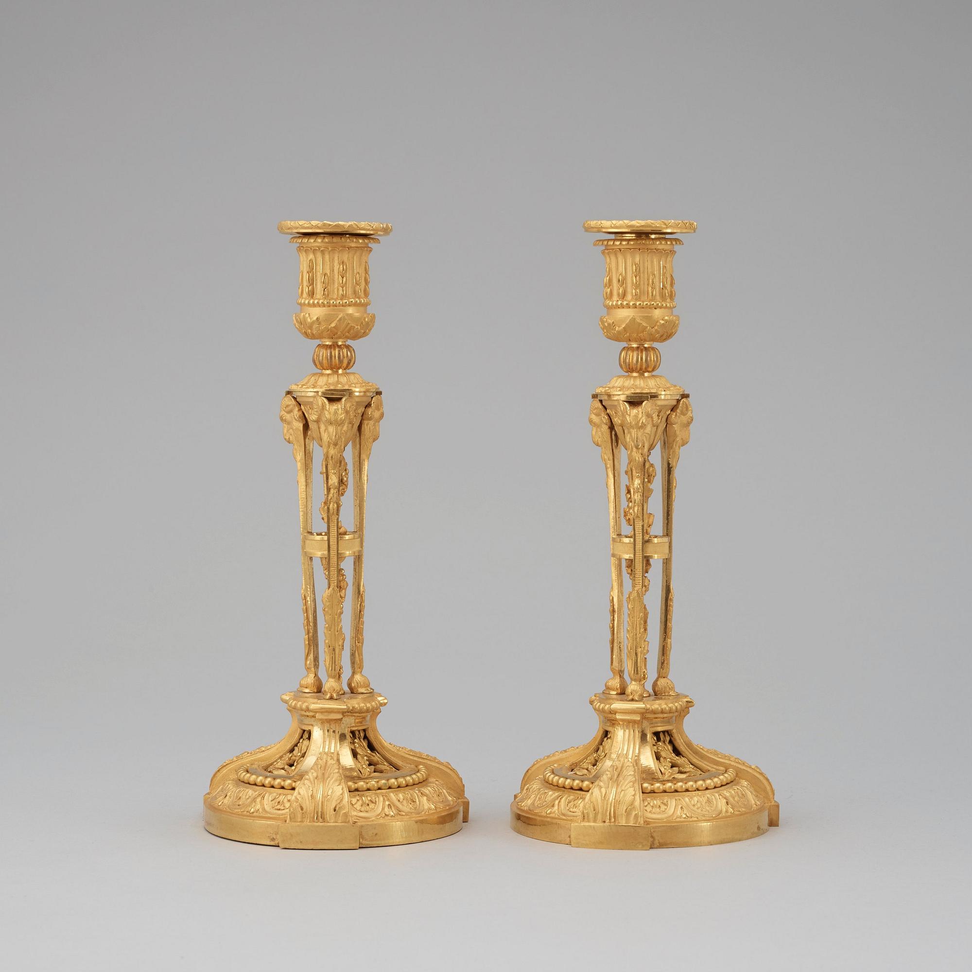 A pair of Louis XVI-style candlesticks, presumably early 20th century.